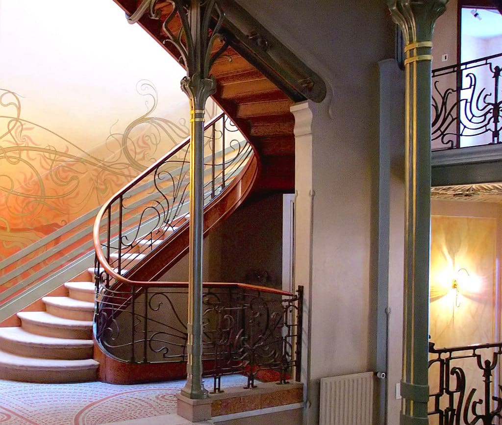 Paradigm shift in architecture: Neoclassicism, Eclecticism, and art Nouveau. Image shows the art nouveau use of iron, glass in interior decoration in tassel house staircase in Brussels.