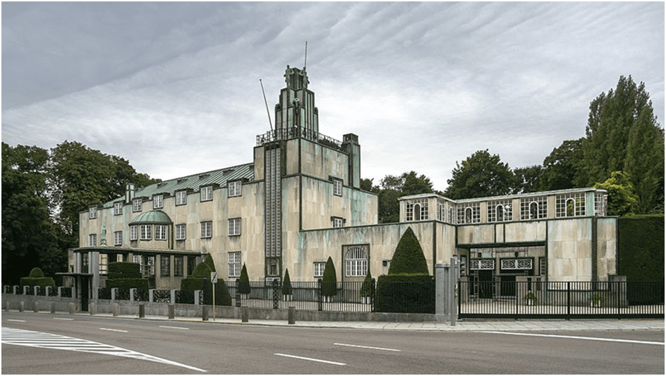 Paradigm shift in architecture: Art Deco, Bauhaus, De Stijl.Image shows stoclet palace building Brussels one of art deco architecture.